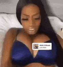 a woman in a blue bra is listening to julie welt