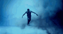 a man is walking on a tightrope in the air in the clouds .
