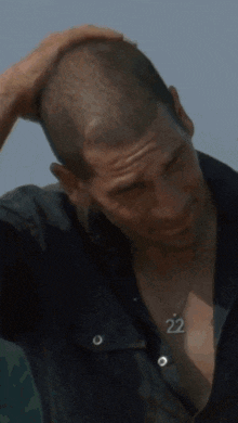 a man with the number 22 on his necklace