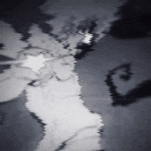 a black and white image of a person with a star in the middle