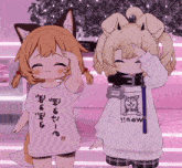 a girl wearing a t-shirt that says wow is standing next to another girl