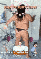 a man in a bikini is standing in front of a birthday cake with a candle .