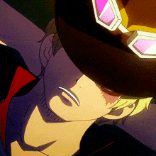 a close up of a person wearing a hat and sunglasses