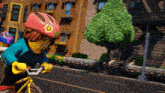 a lego character wearing a pink helmet is riding a bike