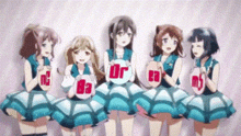a group of anime girls are standing next to each other in a row holding a sign that says r2 .