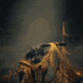 a statue of a demon with a fireball coming out of his head