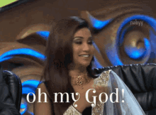 a woman says oh my god while sitting on a couch
