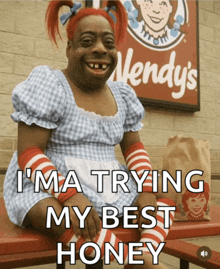 a wendy 's sign is behind a woman in a wendy 's dress