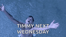 a shirtless man is swimming in a pool with his arms outstretched and the words timmy next wednesday .