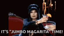 a woman is sitting in a chair holding a martini glass and says it 's jumbo margarita time .
