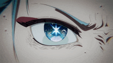 a close up of a person 's eye with a star shining through it