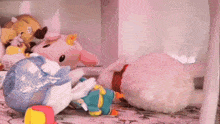 a bunch of stuffed animals are on a table