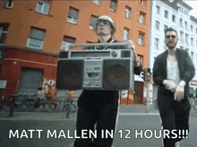 a man is holding a boombox with the words matt mallin in 12 hours written below him .