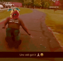 a picture of a person with an apple on their face and the words " unc still got it "