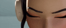 a close up of a woman 's face with headphones