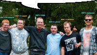 a group of young men posing for a picture with one wearing a ramones t-shirt