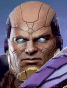 a man with a bald head and blue eyes is wearing a purple helmet and holding a sword .