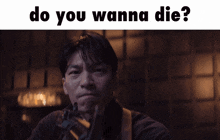 a man holding a gun with the words " do you wanna die " below him