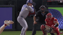 a baseball player with the number 20 on his jersey swings at the ball