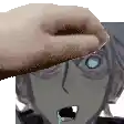 a hand is holding a piece of bread over a person 's face .
