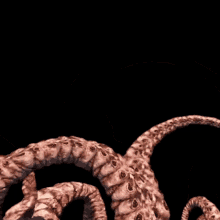a statue of a monster with many tentacles and holes in it
