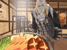 a man is chained to a table looking at a plate of food .