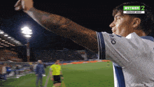 a soccer player wearing a shirt that says eio on the sleeve