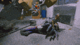 a cartoon character is laying on the floor with boxes and a barrel in the background