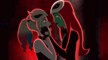 harley quinn and poison ivy are kissing each other in a dark room .