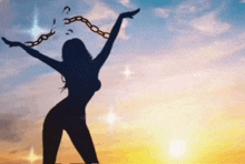a silhouette of a woman with her arms outstretched holding chains around her neck .