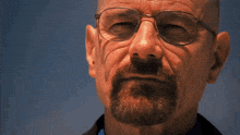 a man with glasses and a beard is saying you 're god damn right