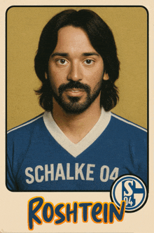 a man with a beard is wearing a blue schalke 04 roshtein jersey