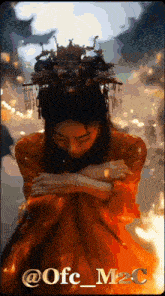 a picture of a woman with a crown on her head and the words @ofc_m2c at the bottom