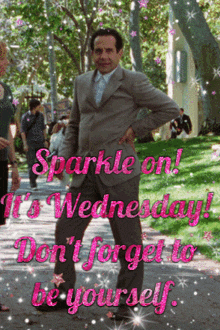 a man in a suit is standing on a sidewalk with the words " sparkle on wednesday "