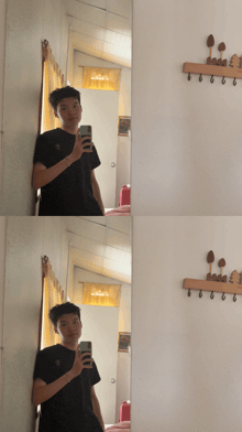 a man taking a selfie in front of a mirror