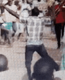 a blurry picture of a group of people dancing on a street