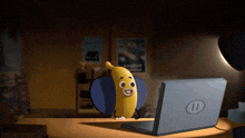 a cartoon of a banana sitting in front of a laptop