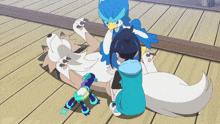 a boy and a bird are playing with a dog on the floor