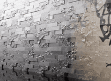 a brick wall with a shadow of a person on it