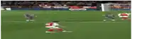 a blurred image of a soccer game with a coca cola ad in the corner