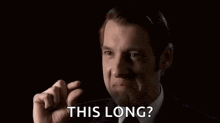 a man in a suit and tie is crying and asking , `` this long ? '' .