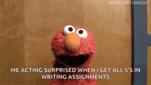elmo from sesame street is smiling and saying `` me acting surprised when i get all 5 's in writing assignments ''