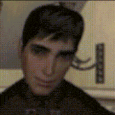 a close up of a man 's face with a polka dot pattern