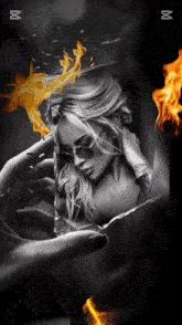 a black and white photo of a woman with fire coming out of her hands
