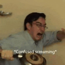 a man is screaming in a bathroom while holding a pot .