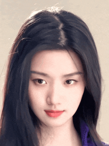 a close up of a woman 's face with long hair and red lips