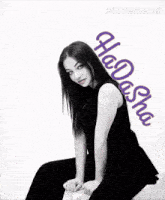 a black and white photo of a woman with the name hadasha on the bottom
