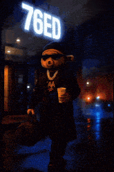 a teddy bear is standing in front of a 76ed sign