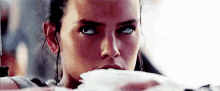 a close up of a woman eating a piece of bread .