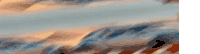 a blurry picture of a sunset over a mountain range